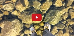 walking across a crystal clear frozen lake