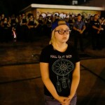 girl stands in front of st louis police