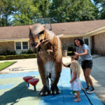 Community Rallies to Rescue Stolen Dinosaur from Goose Creek Business