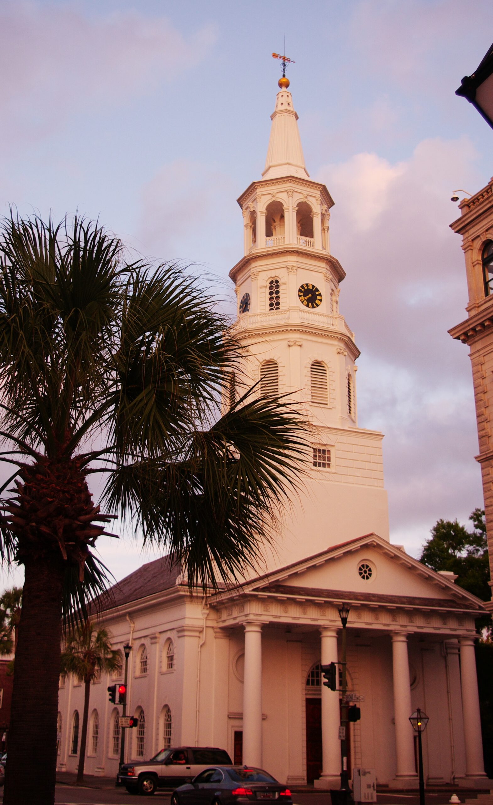 St. Michael’s Church and its white steeple at Meeting and Broad streets in Charleston, photographed at sunset in August 2012.